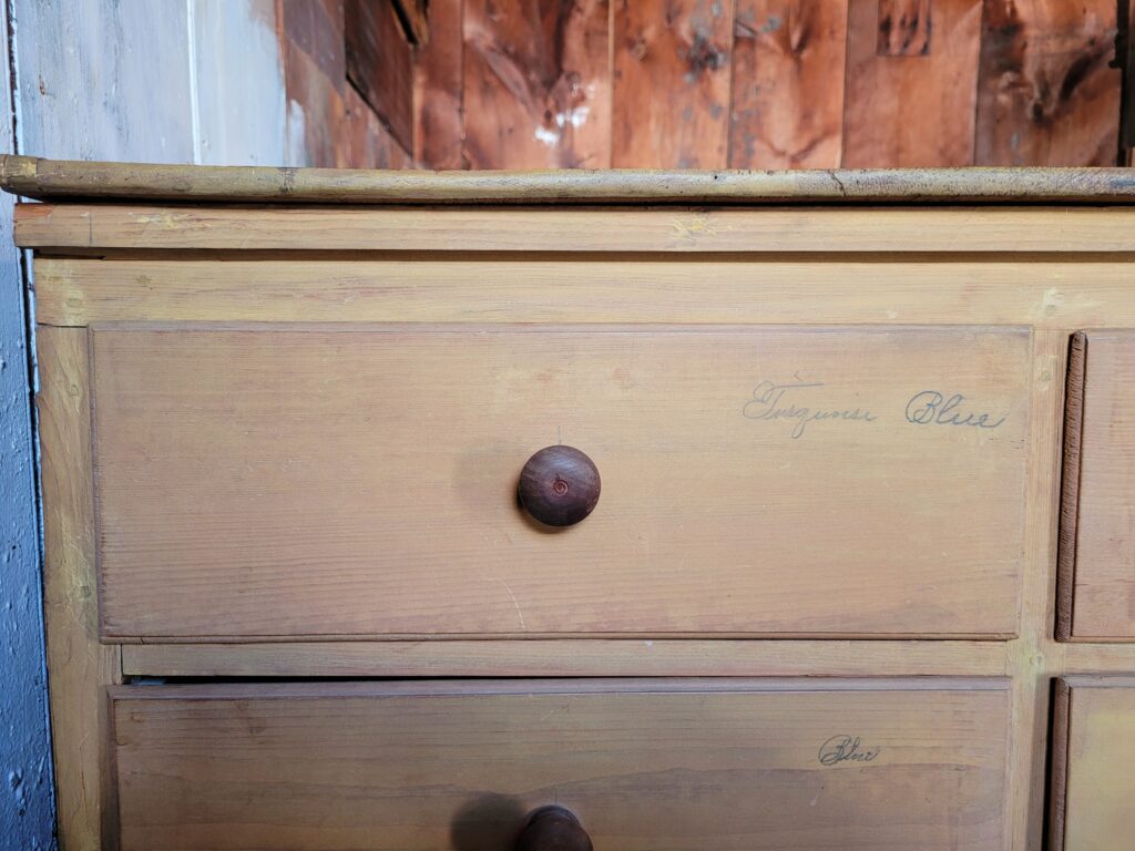 Examples of Spencerian penmanship are penciled on this storage chest of drawers.